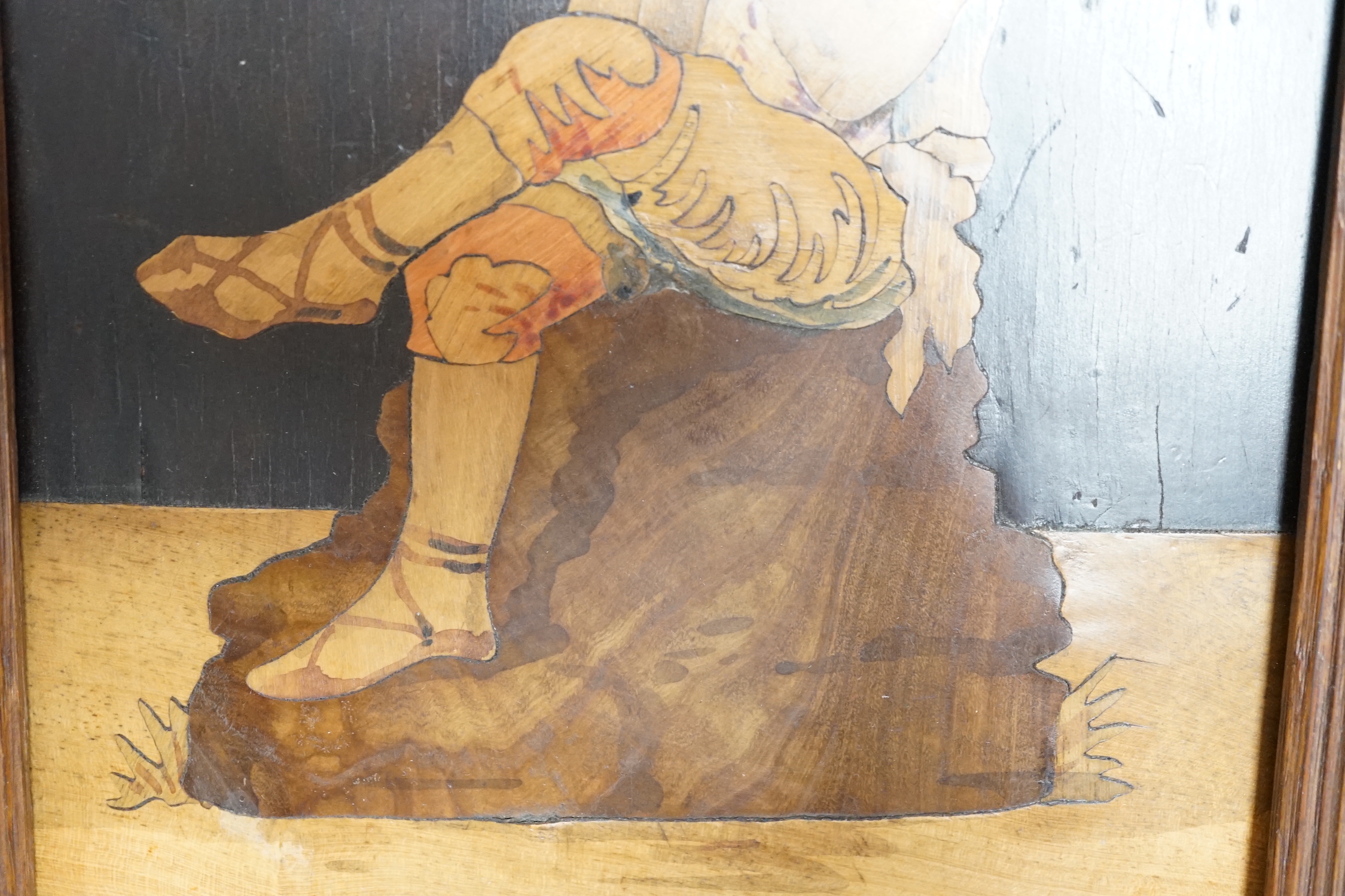 A Sorrentoware marquetry panel of a boy playing a flute, 14cm wide, 21.5cm high